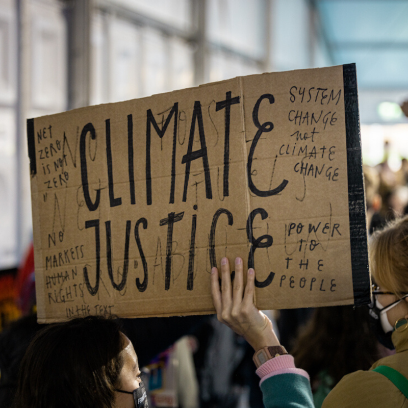 A sign reading "climate justice"