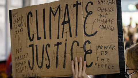 A sign reading "climate justice"